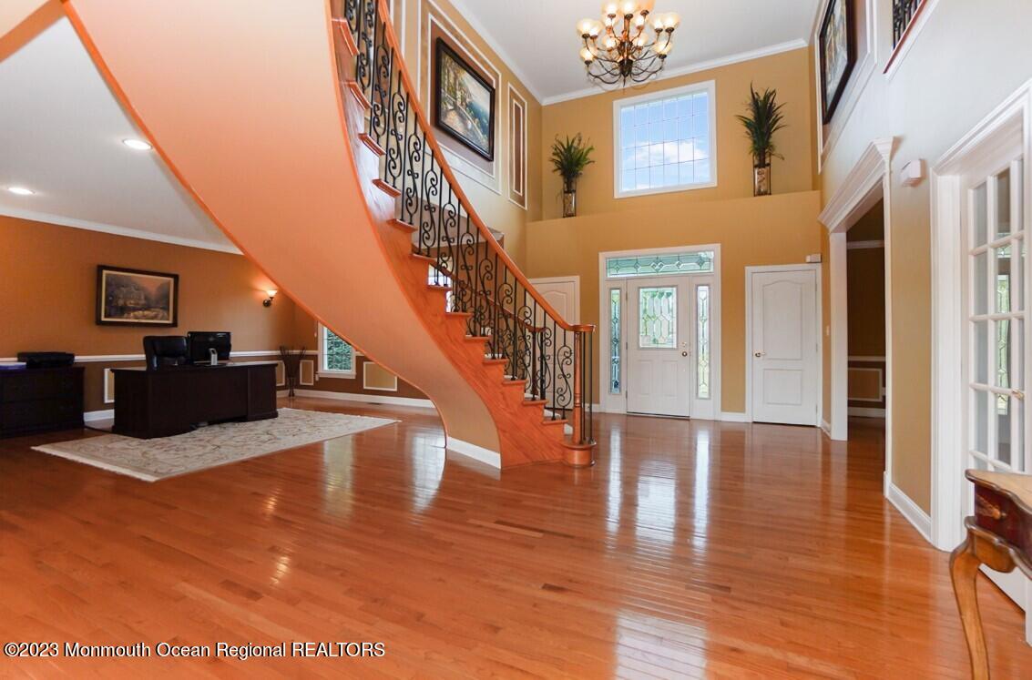 15 Great Bridge Road Freehold, NJ 07728 - Photo 8 of 57 a view of entryway and hall with wooden floor