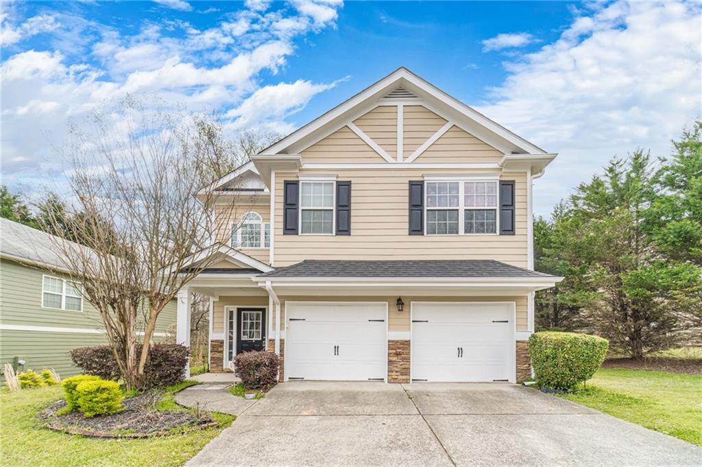 a front view of a house with a yard