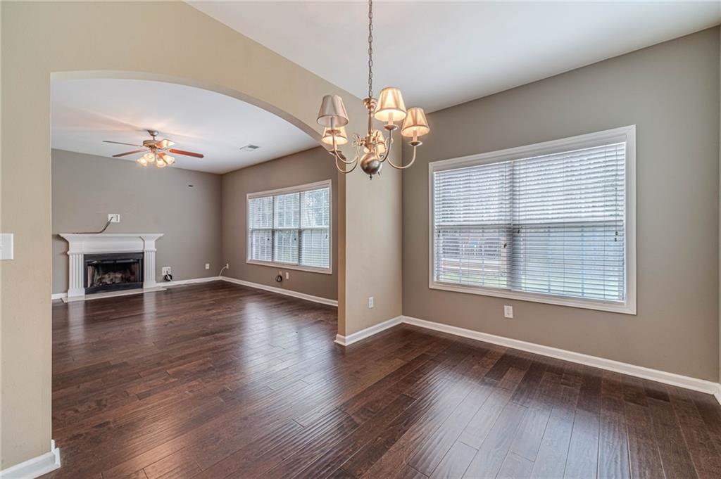 6503 Silk Tree Pointe Braselton, GA 30517 - Photo 14 of 47 a view of an empty room with wooden floor and a window