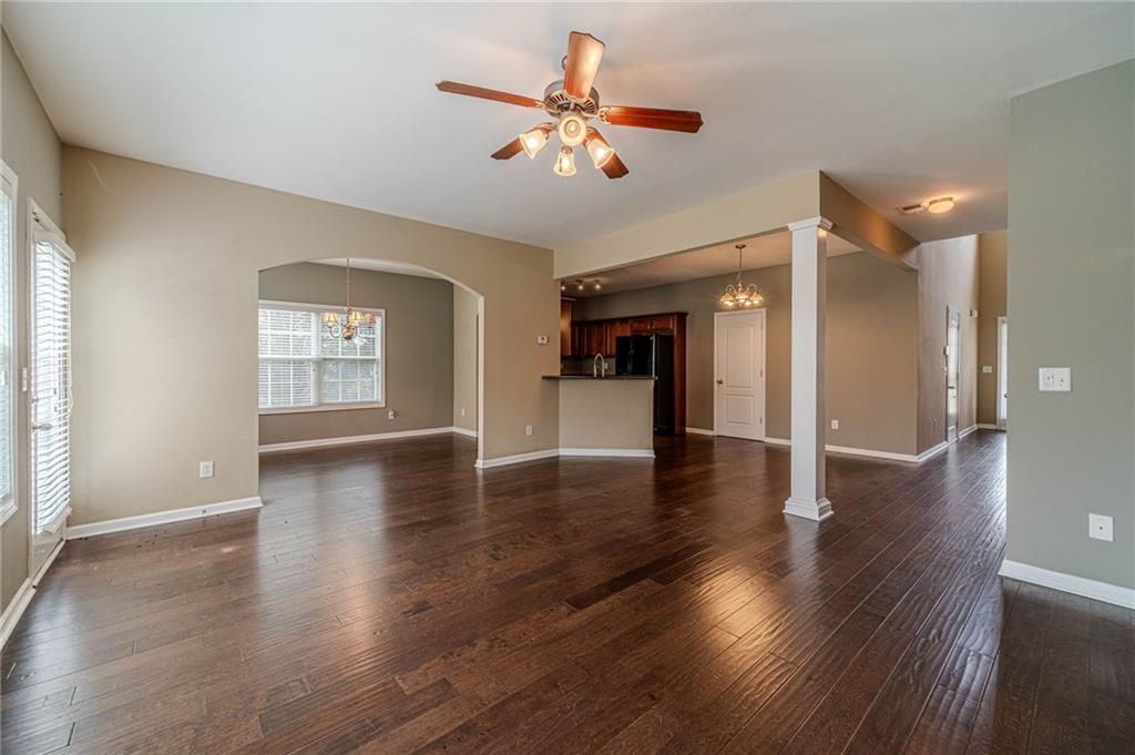 6503 Silk Tree Pointe Braselton, GA 30517 - Photo 19 of 47 an empty room with wooden floor and a ceiling fan