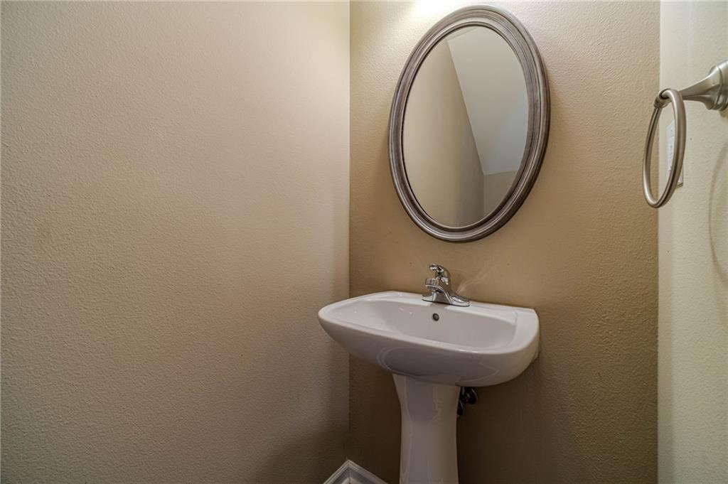 6503 Silk Tree Pointe Braselton, GA 30517 - Photo 20 of 47 a bathroom with a sink and a mirror