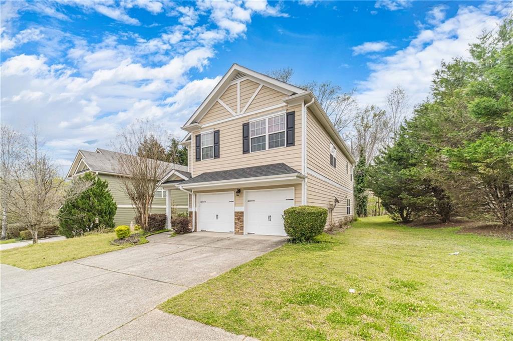 6503 Silk Tree Pointe Braselton, GA 30517 - Photo 2 of 47 a view of a white house with a yard