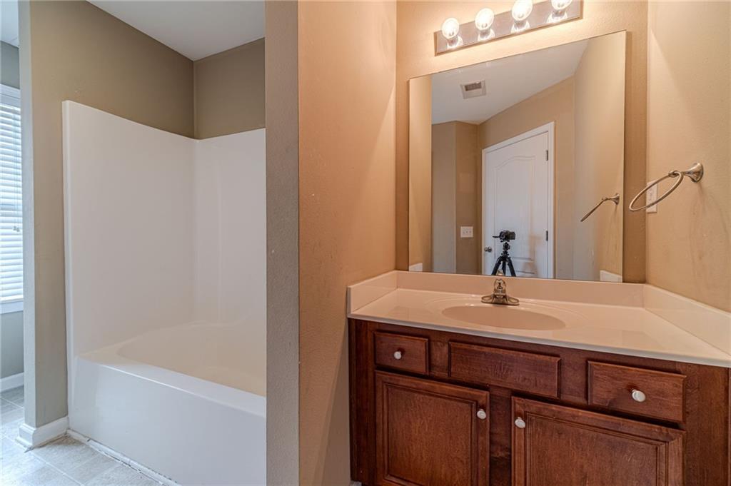 6503 Silk Tree Pointe Braselton, GA 30517 - Photo 23 of 47 a bathroom with a sink and a mirror