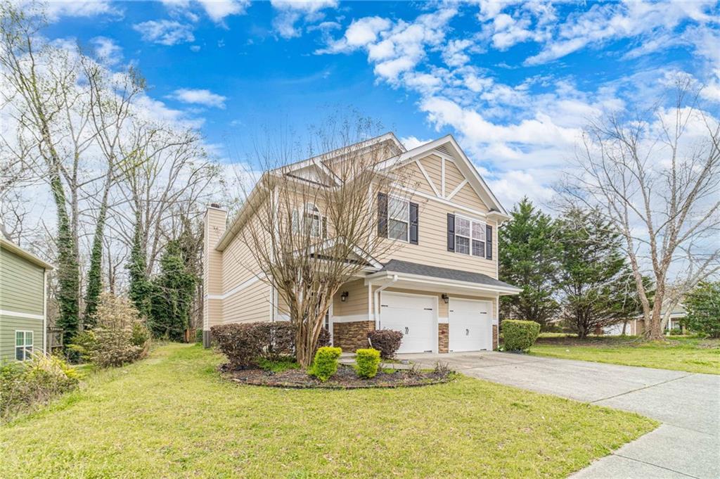 6503 Silk Tree Pointe Braselton, GA 30517 - Photo 3 of 47 a view of a white house with a big yard and large tree