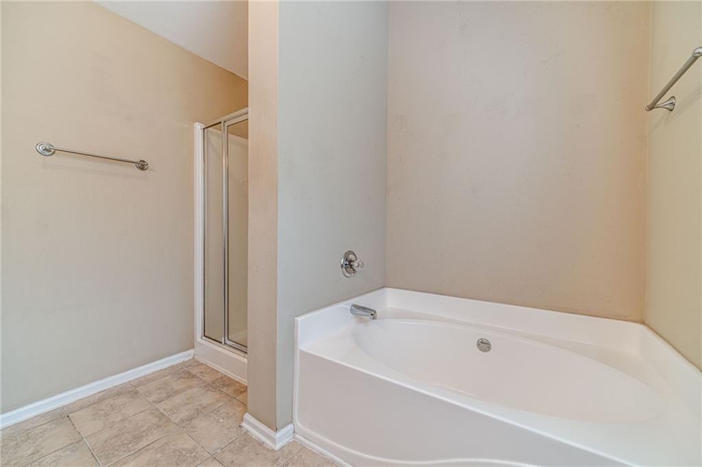 6503 Silk Tree Pointe Braselton, GA 30517 - Photo 36 of 47 a white bath tub sitting next to a white tub