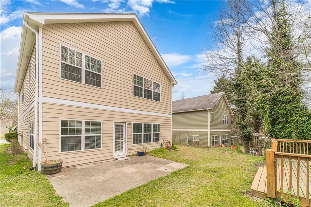 6503 Silk Tree Pointe Braselton, GA 30517 - Photo 44 of 47 a front view of a house with a yard