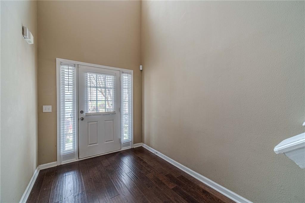 6503 Silk Tree Pointe Braselton, GA 30517 - Photo 5 of 47 a view of an empty room with wooden floor and a window