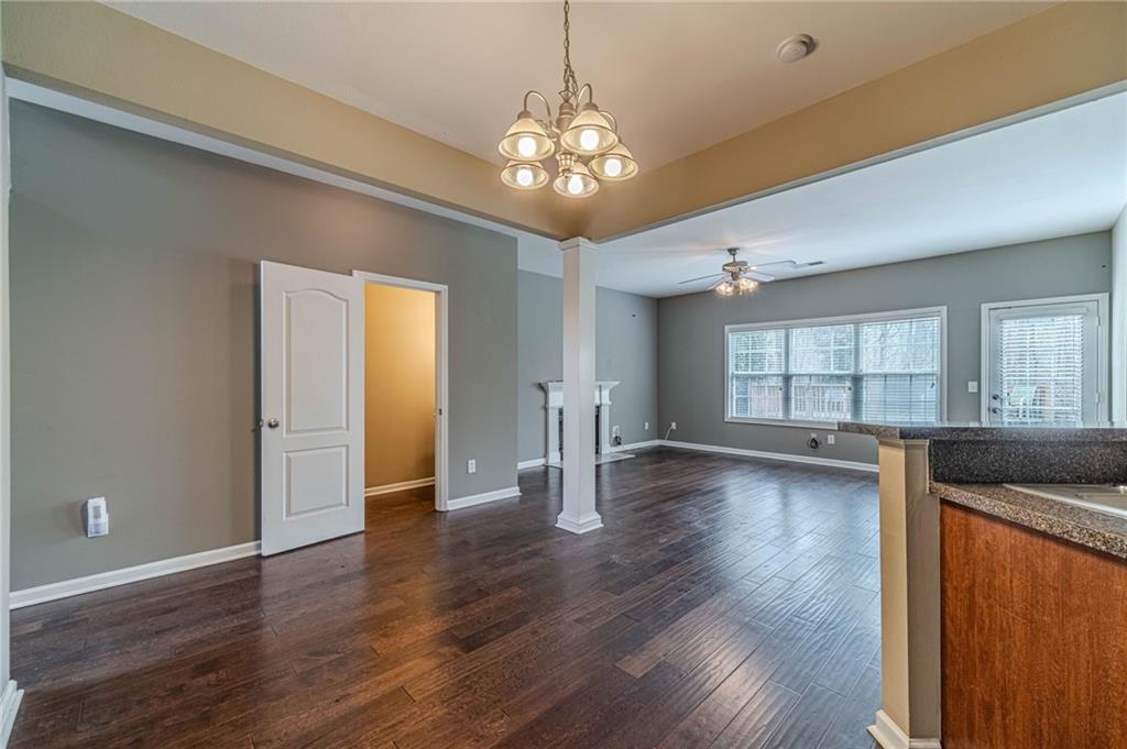 6503 Silk Tree Pointe Braselton, GA 30517 - Photo 9 of 47 a view of a room with wooden floor and chandelier