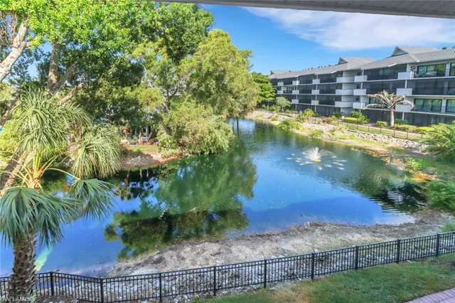 a view of a lake with a yard