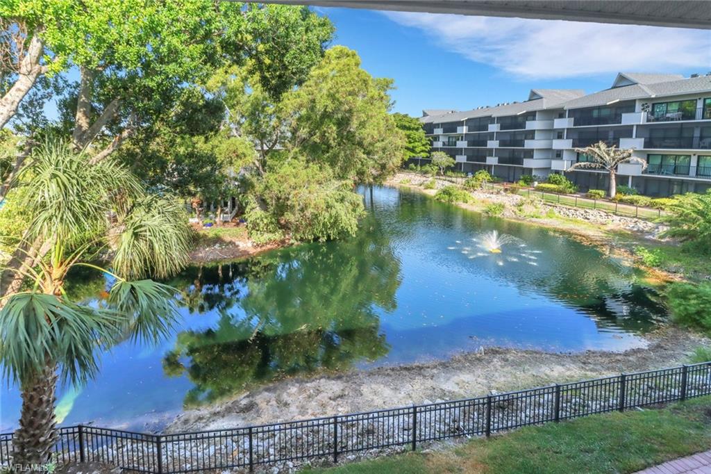 a view of a lake with a yard