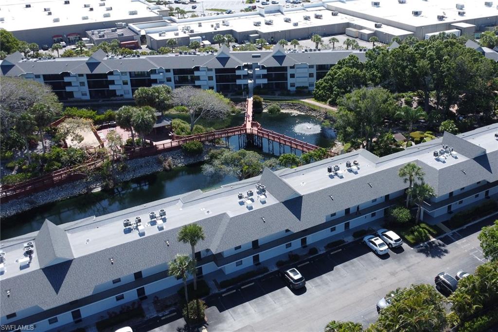 600 Neapolitan Way, Unit 345 Naples, FL 34103 - Photo 30 of 43 Drone / aerial view of a nearby body of water