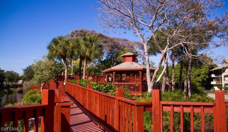 600 Neapolitan Way, Unit 345 Naples, FL 34103 - Photo 39 of 43 View of play area with a gazebo
