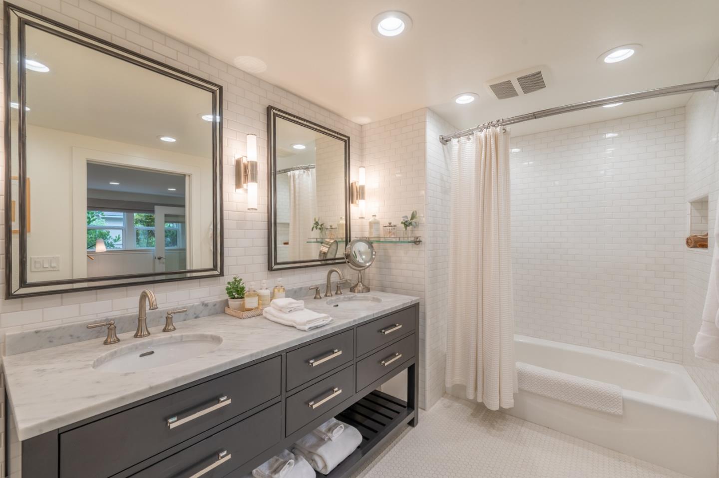 0 SE Corner Monte Verde & Third Carmel, CA 93921 - Photo 19 of 28 a bathroom with a granite countertop sink mirror and a bath tub