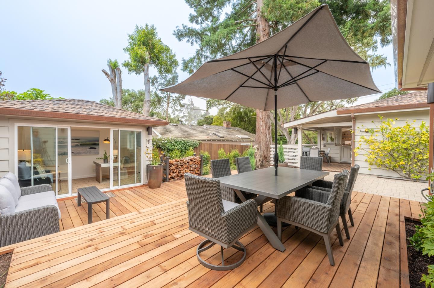 0 SE Corner Monte Verde & Third Carmel, CA 93921 - Photo 20 of 28 a view of a patio with table and chairs under an umbrella with wooden floor