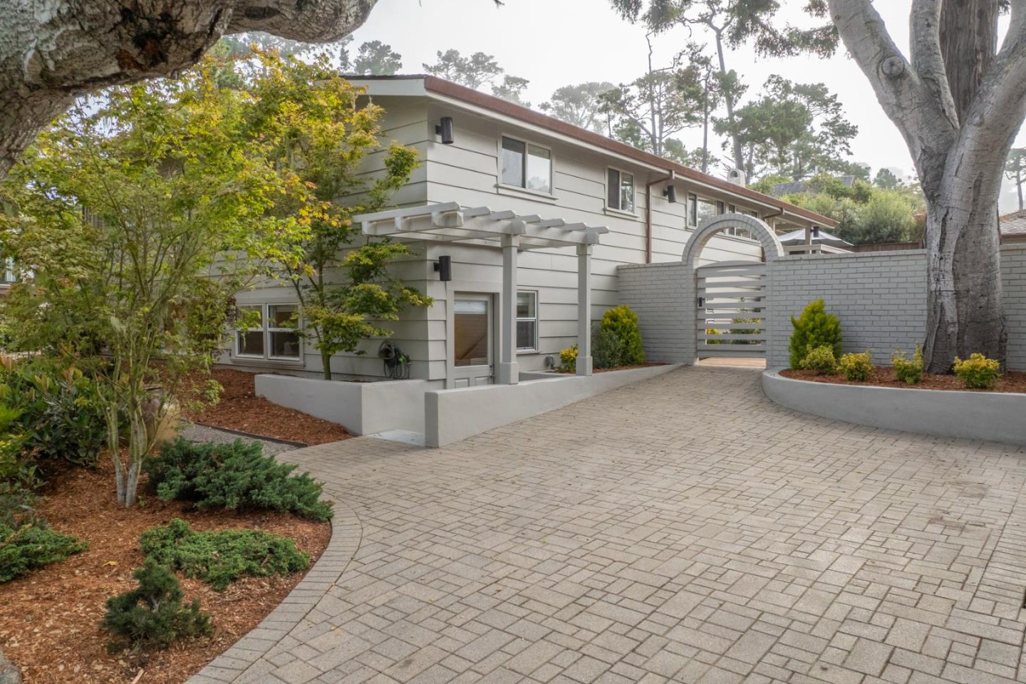0 SE Corner Monte Verde & Third Carmel, CA 93921 - Photo 28 of 28 a view of a house with potted plants and large trees
