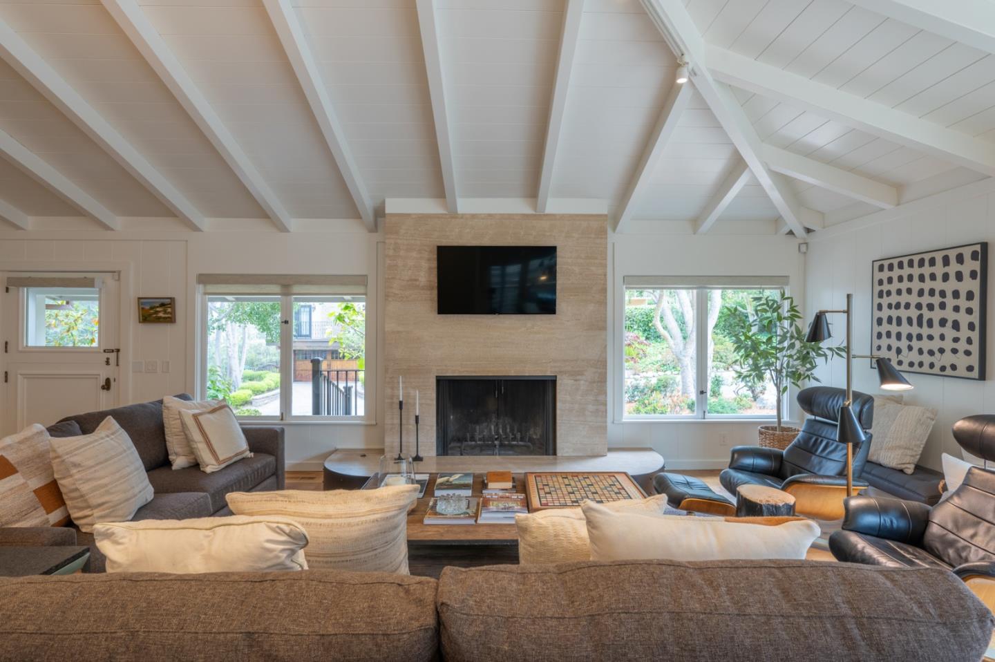 0 SE Corner Monte Verde & Third Carmel, CA 93921 - Photo 3 of 28 a living room with furniture a fireplace and a large window