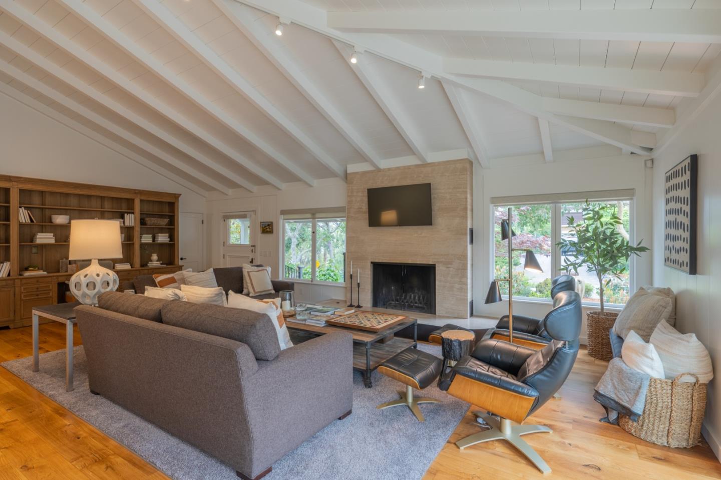 0 SE Corner Monte Verde & Third Carmel, CA 93921 - Photo 4 of 28 a living room with furniture a fireplace and a floor to ceiling window