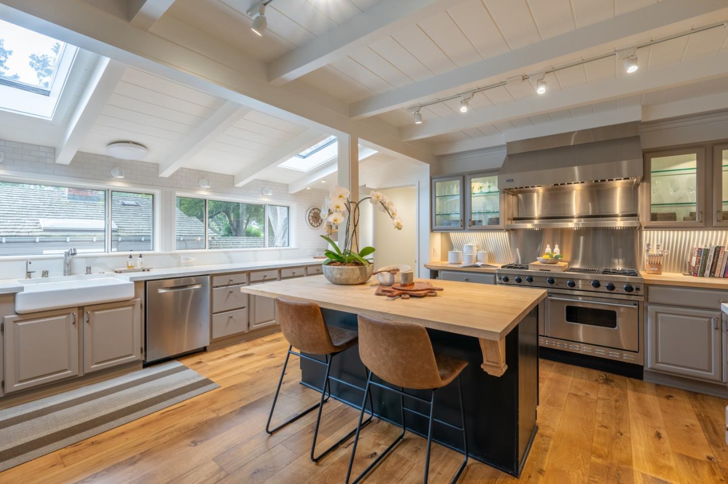 0 SE Corner Monte Verde & Third Carmel, CA 93921 - Photo 7 of 28 a kitchen with a table chairs stove and cabinets