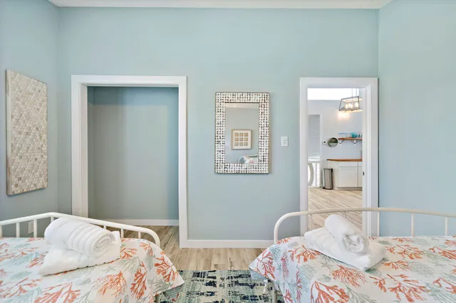 a bedroom with a bed and wall painting