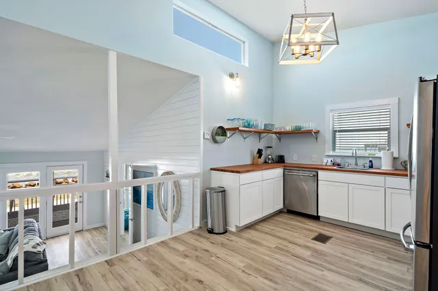 a kitchen with cabinets a sink and appliances