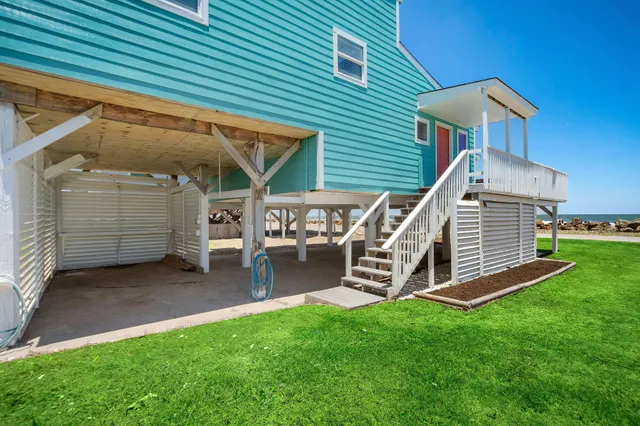 an aerial view of a house with pool yard and outdoor seating
