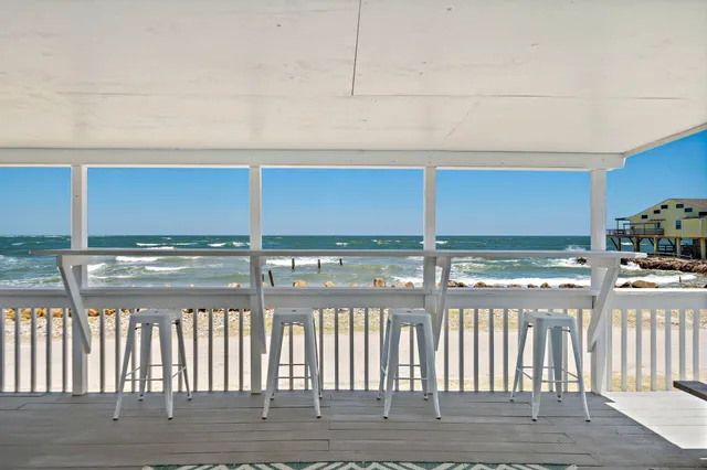 a view of a kitchen with a large window