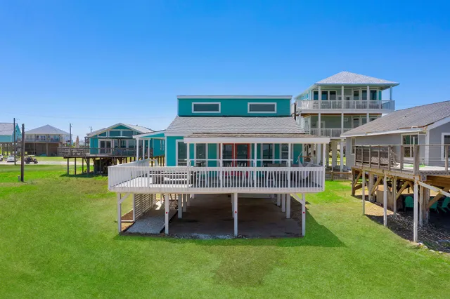 a view of a house with a yard porch and sitting area