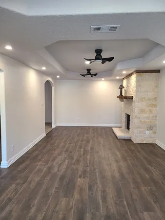 a view of a livingroom with a ceiling fan and window