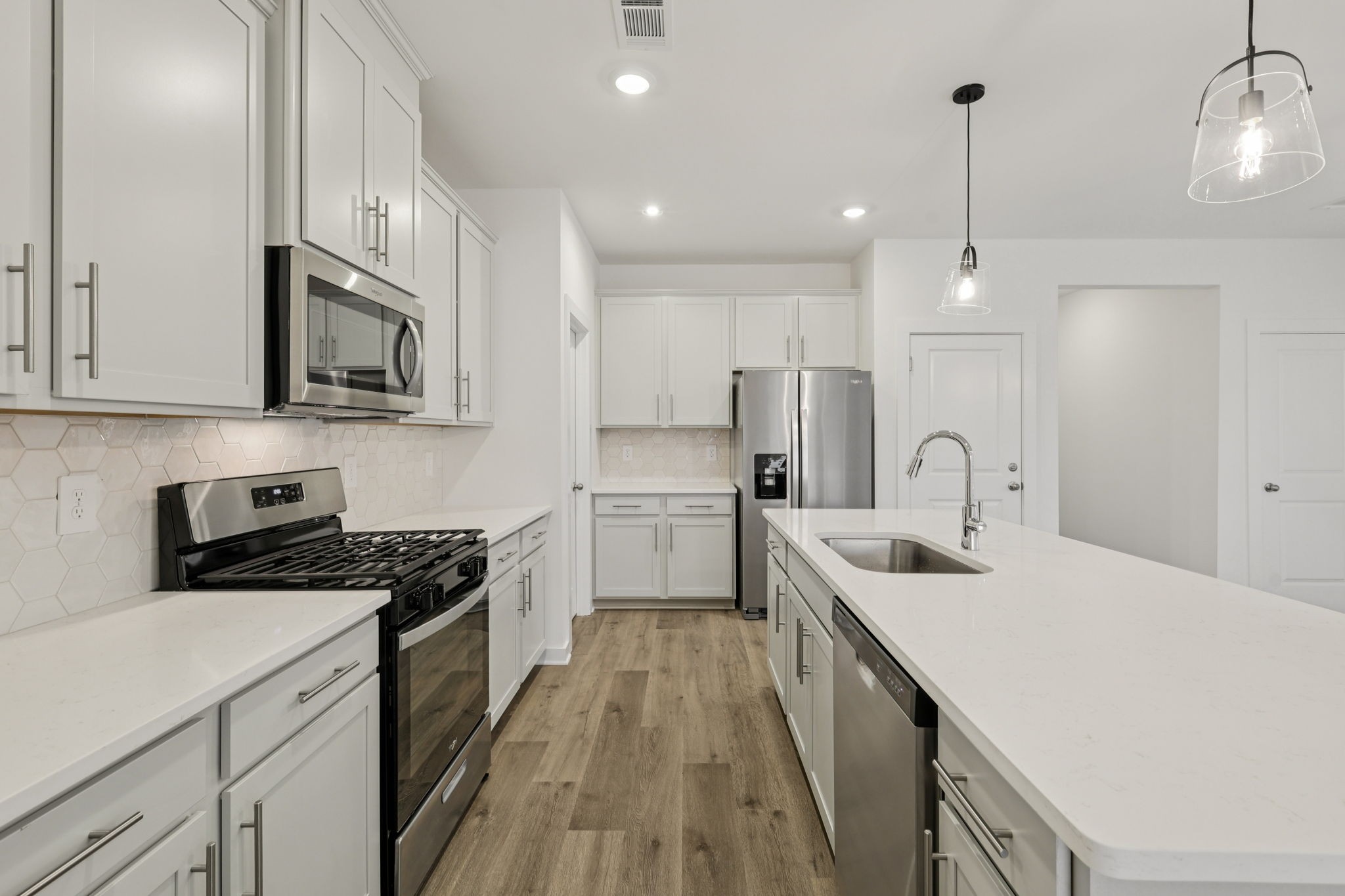 1524 Bear Branch Trace Columbia, TN 38401 - Photo 13 of 55 a kitchen with stainless steel appliances granite countertop a sink stove and refrigerator