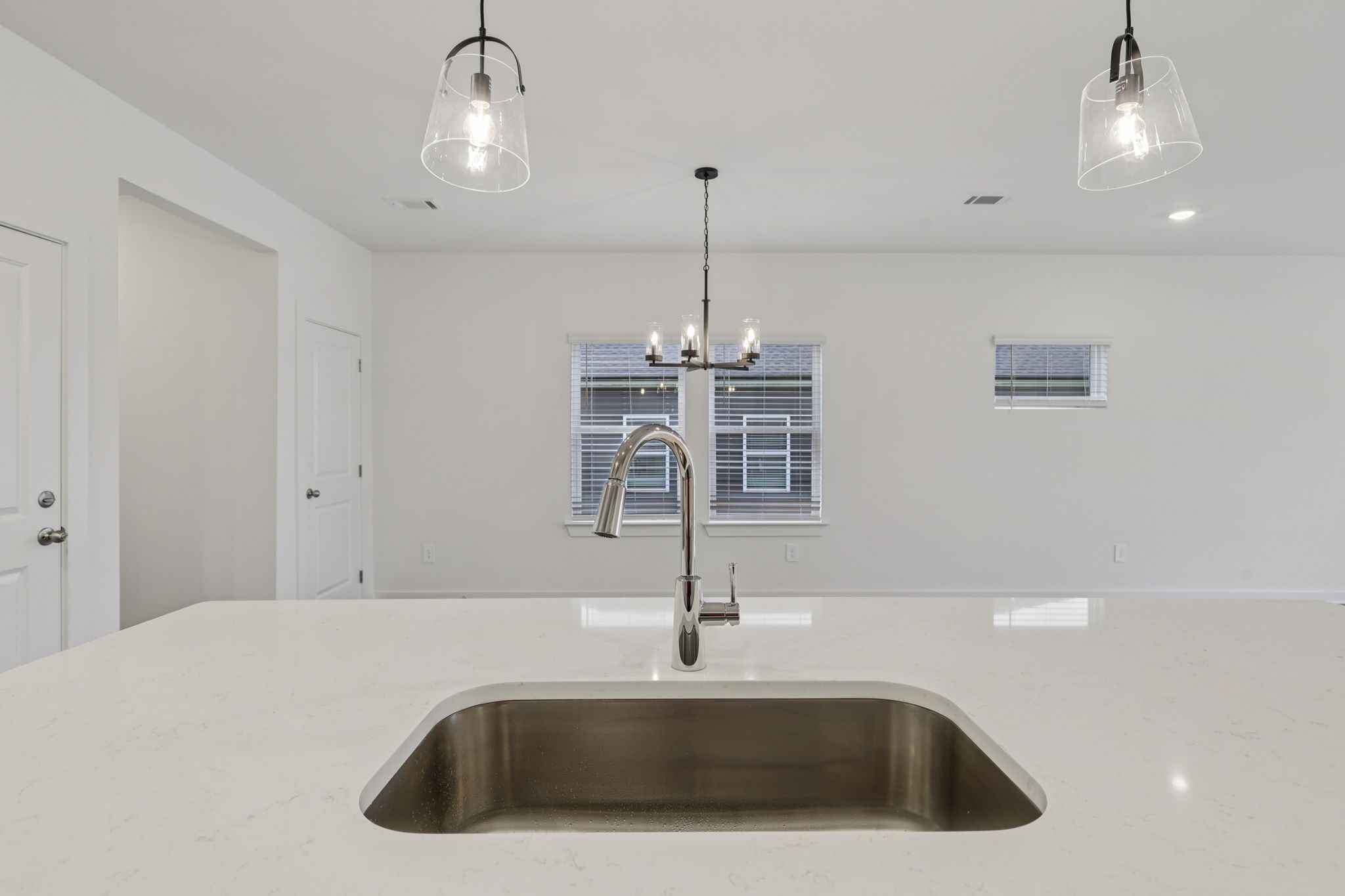 1524 Bear Branch Trace Columbia, TN 38401 - Photo 14 of 55 a kitchen with a sink cabinetry and chandelier