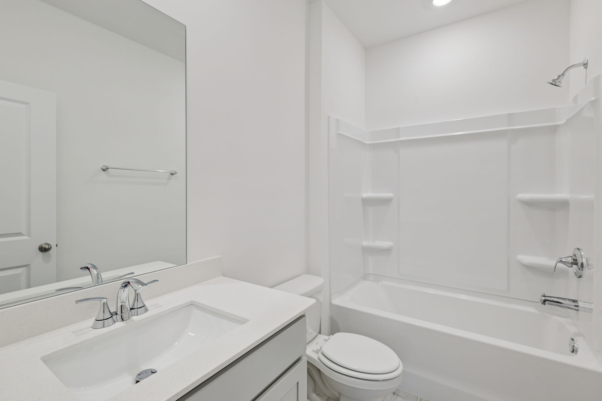 1524 Bear Branch Trace Columbia, TN 38401 - Photo 16 of 55 a bathroom with a bathtub shower sink vanity mirror and toilet