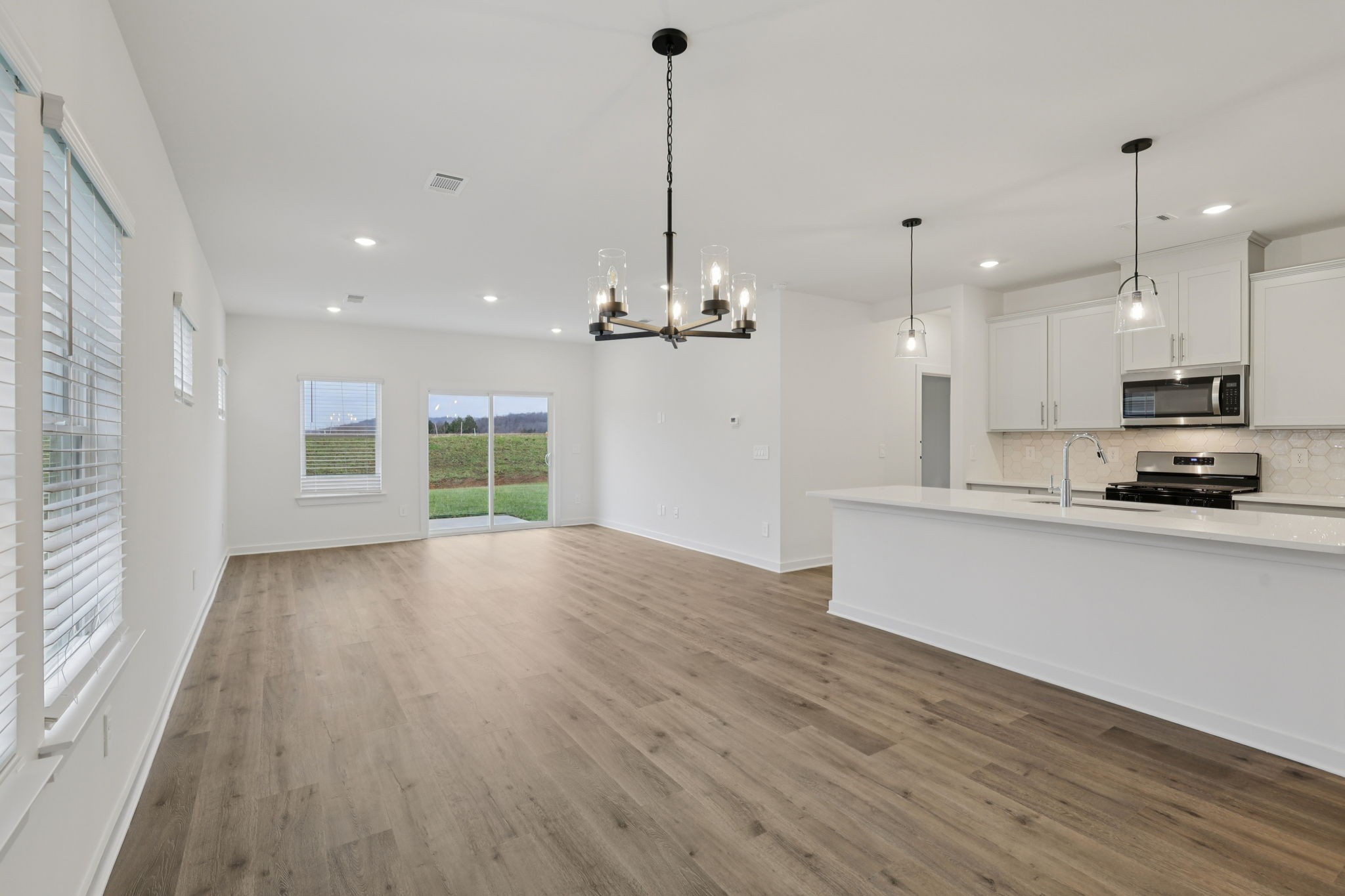1524 Bear Branch Trace Columbia, TN 38401 - Photo 7 of 55 a view of a kitchen with a sink and wooden floor