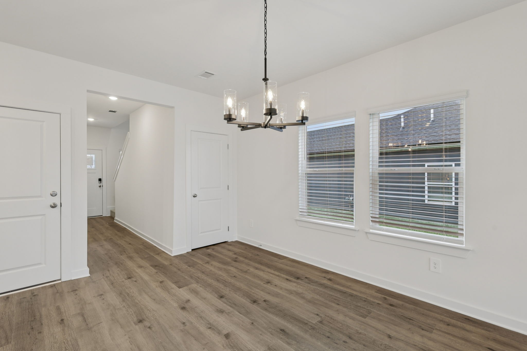 1524 Bear Branch Trace Columbia, TN 38401 - Photo 8 of 55 a view of a livingroom with a chandelier wooden floor and windows