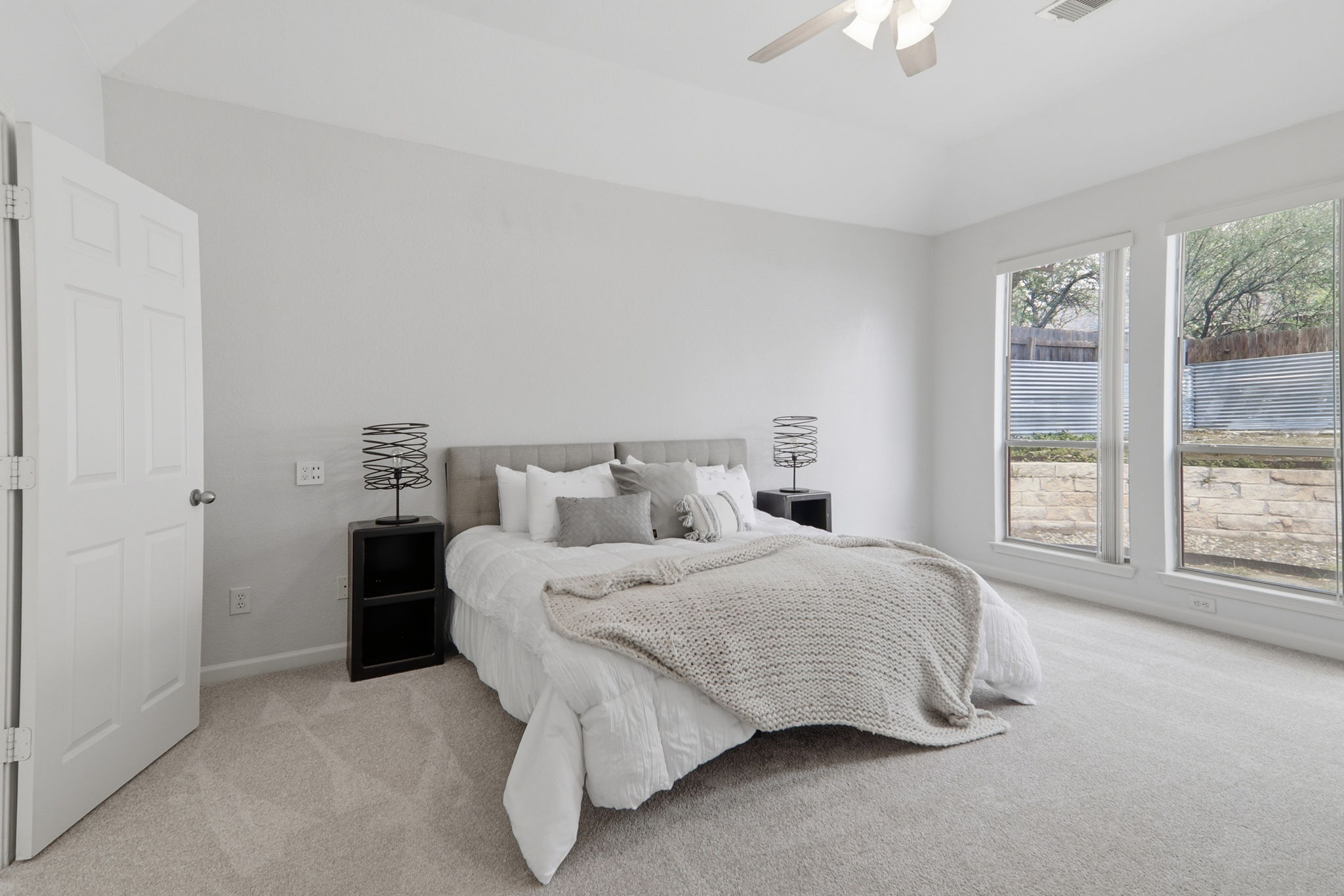 500 Red Hawk Drive Leander, TX 78641 - Photo 13 of 35 Bedroom featuring light colored carpet, lofted ceiling, and a ceiling fan
