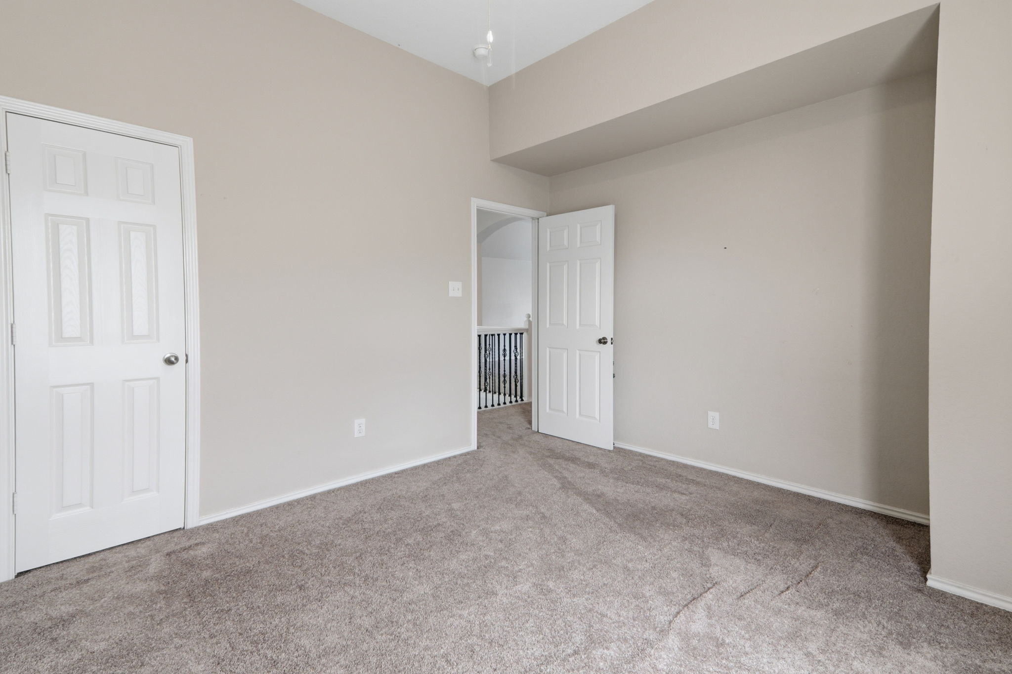 500 Red Hawk Drive Leander, TX 78641 - Photo 28 of 35 Unfurnished bedroom with light colored carpet and baseboards