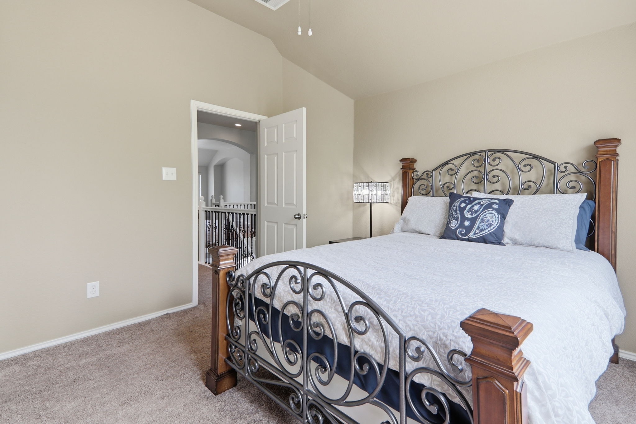 500 Red Hawk Drive Leander, TX 78641 - Photo 31 of 35 Bedroom featuring light colored carpet and vaulted ceiling