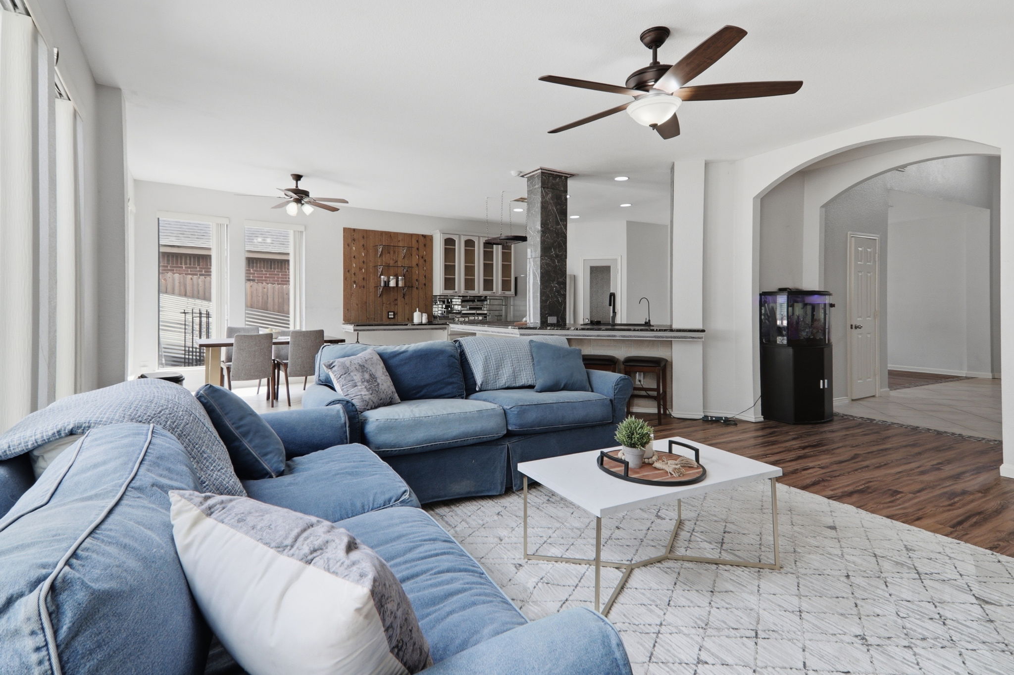 500 Red Hawk Drive Leander, TX 78641 - Photo 5 of 35 Living room featuring a ceiling fan, wood finished floors, and arched walkways