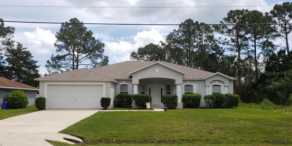 15 Ruth Drive Palm Coast, FL 32164 - Photo 1 of 1 a front view of a house with a yard