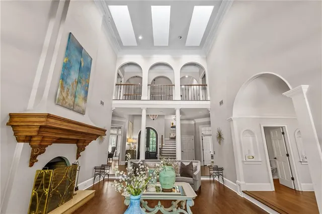 a living room with furniture a fireplace and a window