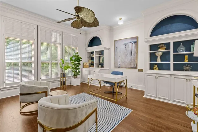a living room with furniture and a floor to ceiling window