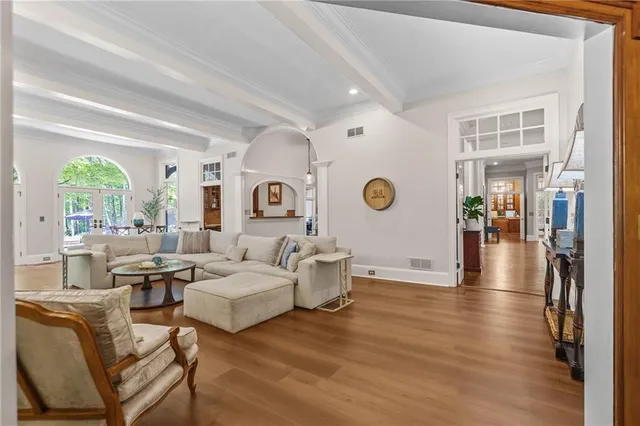 a view of a room with furniture window and wooden floor
