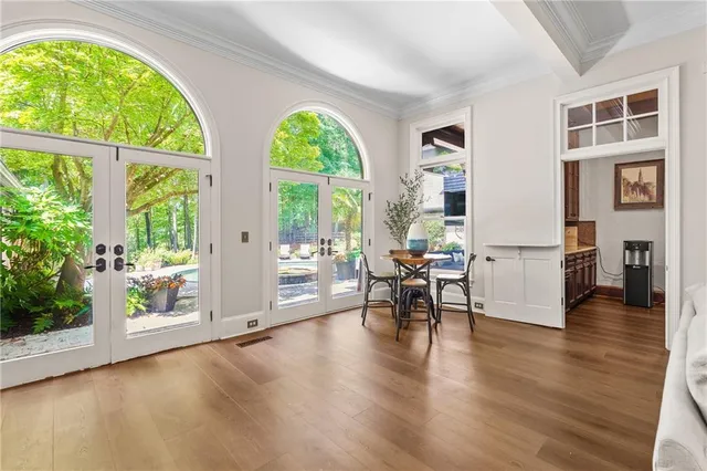 a view of a hallway with wooden floor