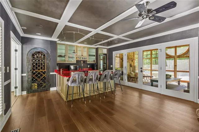 a kitchen with stainless steel appliances granite countertop a sink and a stove