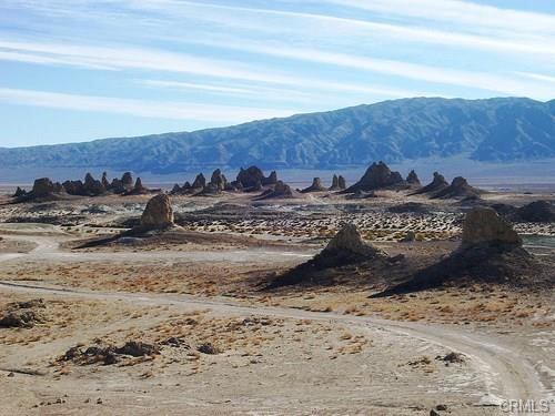 82300 3rd Street Trona, CA 93562 - Photo 4 of 10 a view of a dry yard with wooden fence