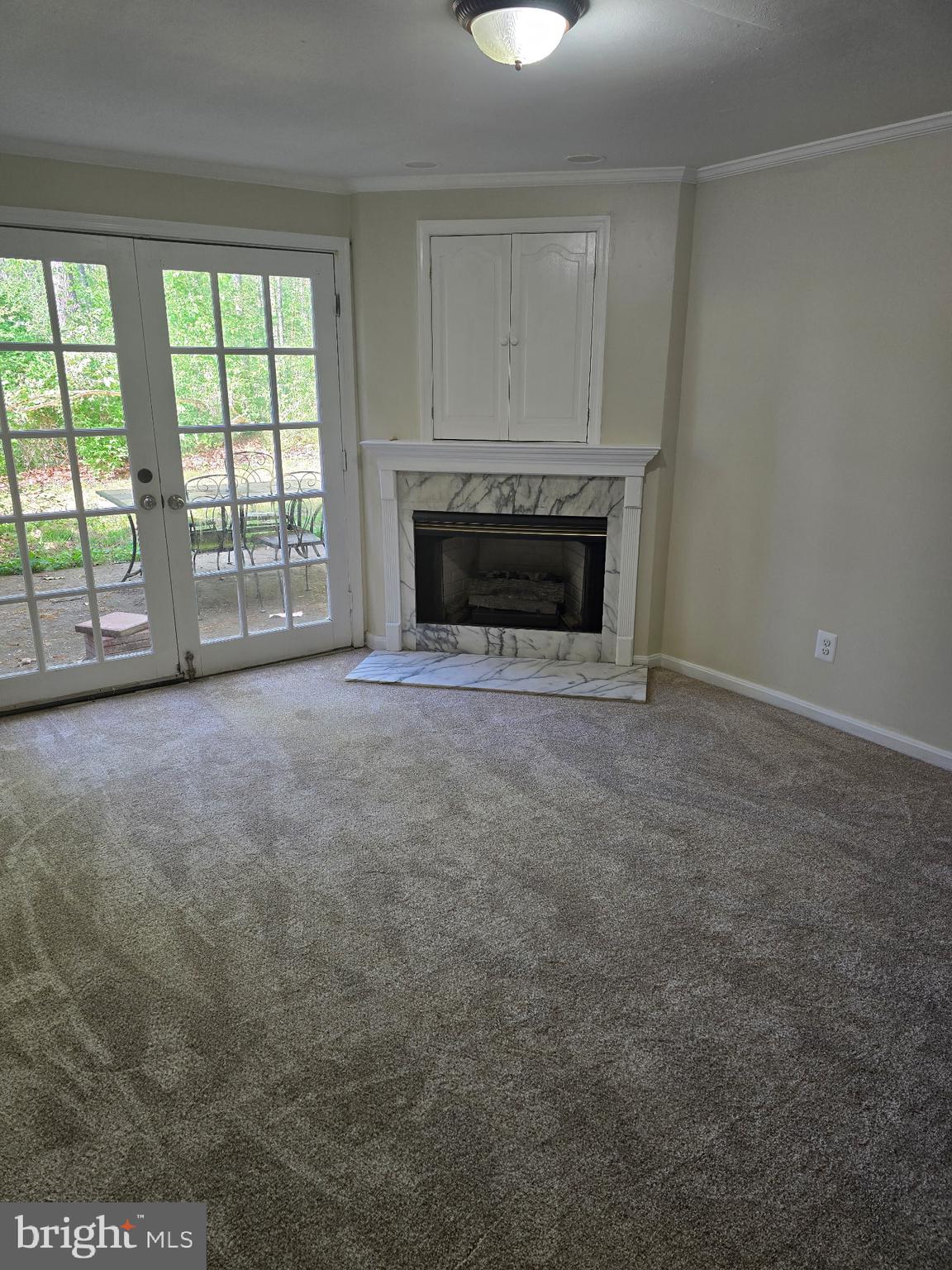 439 Ridgemore Street Fredericksburg, VA 22405 - Photo 11 of 17 an empty room with windows and fireplace