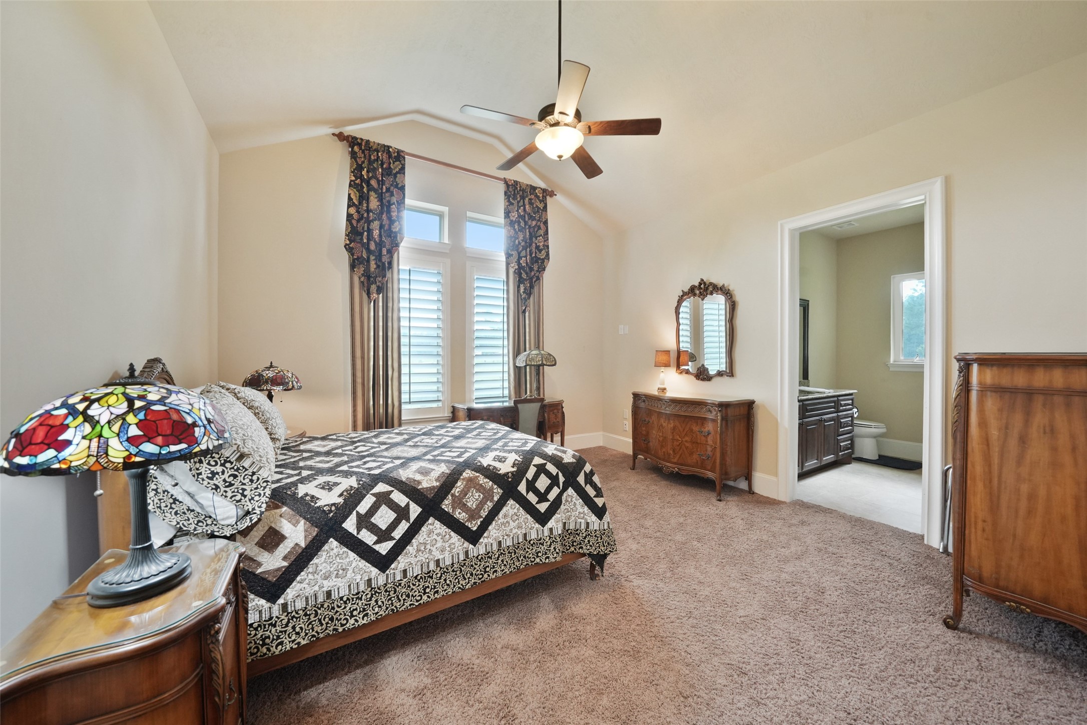 26250 A Riley Road Waller, TX 77484 - Photo 15 of 50 Front bedroom with high ceilings, casement windows, and private ensuite layout.