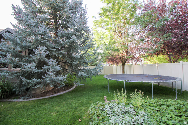 288 525 South Providence, UT 84332 - Photo 53 of 71 Fenced backyard featuring a trampoline
