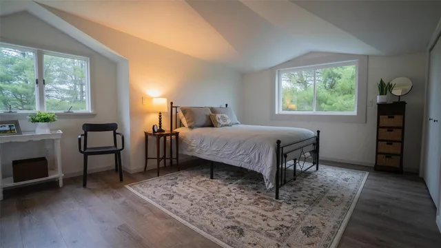 a bedroom with a bed and a fireplace