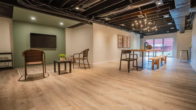 a livingroom with furniture and a flat screen tv
