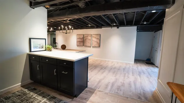 a kitchen with a sink and cabinets